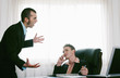 Foto: Businessman listening to his assistant talking. Businessman listening to his assistant talking.