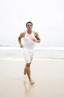 Photo: Man running on the beach Man running on the beach