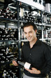 Man holding a bottle of wine