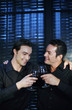 Two men proposing a toast