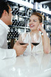 Man and woman sitting at bar counter talking