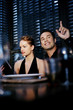 Man raising his hand, asking for waiter