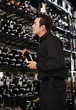 Man choosing wine in the wine cellar