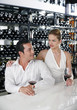 Man and woman sitting at bar counter talking