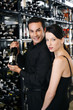 Couple choosing wine in the wine cellar