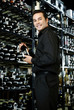 Man choosing wine in the wine cellar