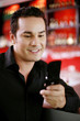 Man text messaging on his mobile phone