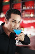 Man enjoying his glass of cocktail