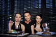Man and two women posing for the camera