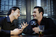 Man talking to his friend while drinking in a bar