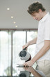 Foto: Man pouring water into a glass Man pouring water into a glass