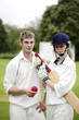 Foto: Man and woman holding a cricket bat and a cricket ball Man and woman holding a cricket bat and a cricket ball