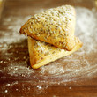 Fresh seeded triangular Italian bread rolls
