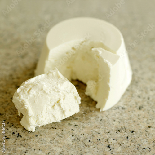 Photo: Fresh Italian ricotta cheese on a marble chopping board Fresh Italian ricotta cheese on a marble chopping board