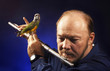 Man playing flute with bird on it