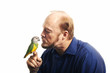 Man kissing bird