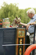 Foto: Senior man and dog on the houseboat Senior man and dog on the houseboat