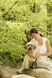Woman and dog hanging out in the park