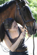 Woman playing with her horse