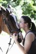 Woman kissing horse