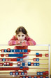 Girl posing with a large abacus
