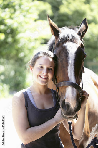 Photo: Woman posing with her horse Woman posing with her horse