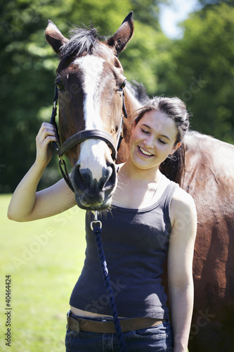 Photo: Woman posing with her horse Woman posing with her horse