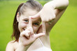 Girl making a sign
