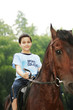 Boy riding a horse