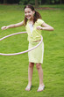 Foto: Girl playing the hula hoop Girl playing the hula hoop