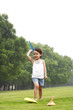 Little girl throwing paper planes