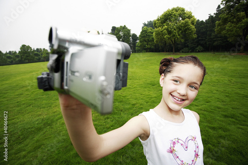 Photo: Girl recording images of herself Girl recording images of herself