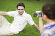 Boy recording images of man