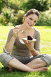 Young woman indulging in a piece of chocolate cake