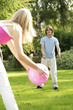Young man and woman having a ball game