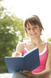 Girl writing in a book
