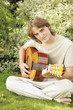 Photo: Young man playing the guitar Young man playing the guitar