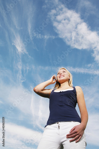 Photo: Young woman talking on the phone Young woman talking on the phone