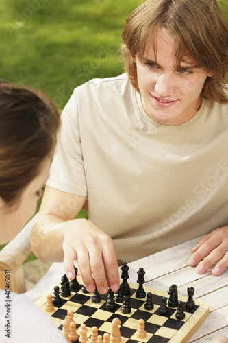 Photo: Couple playing chess Couple playing chess