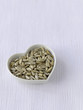 Sunflower seeds in a heart-shaped bowl