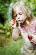 Girl playing with soap bubbles
