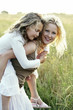 Woman carrying girl
