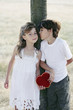 Boy giving girl a kiss