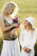 Photo: Woman and girl looking at each other Woman and girl looking at each other