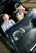 Senior couple traveling in the car