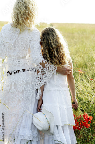Photo: Woman and girl in the meadow Woman and girl in the meadow