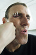 Man getting a punch on his face