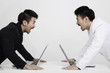 Two businessmen screaming at each other