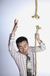 Businessman falling from broken rope