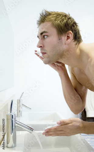 Photo: Man applying shaving cream on his face Man applying shaving cream on his face